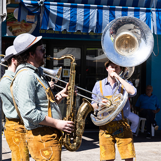 a group of brass musicians on the street